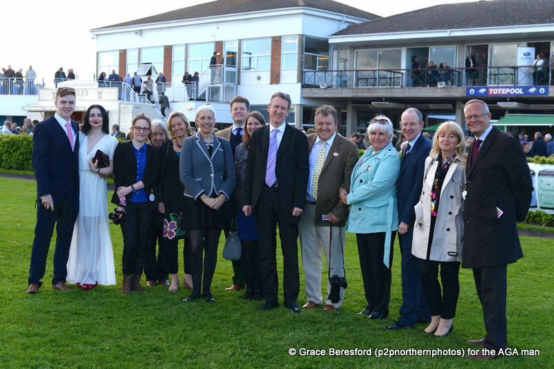 The AGA guests line up for a photo call in the parade ring before the AGA final
